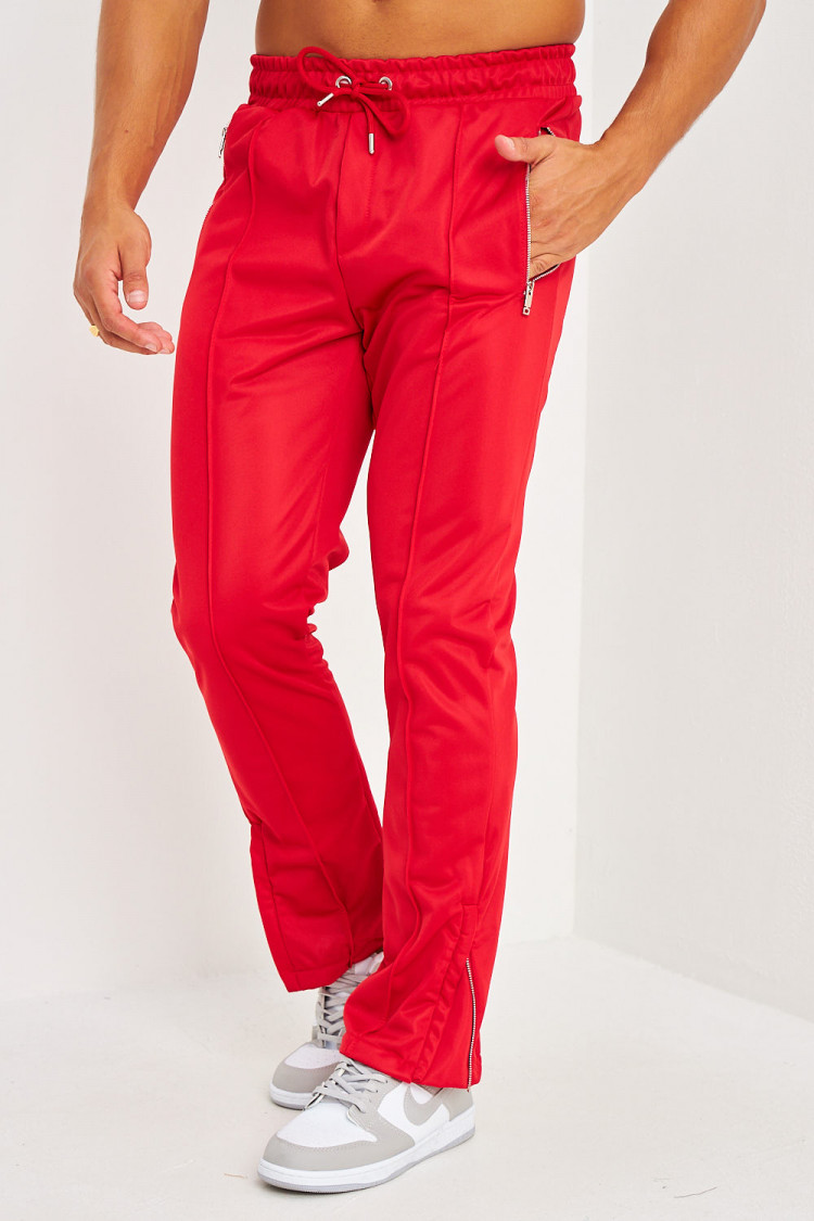 Pantalon de jogging rouge satiné zippé aux chevilles