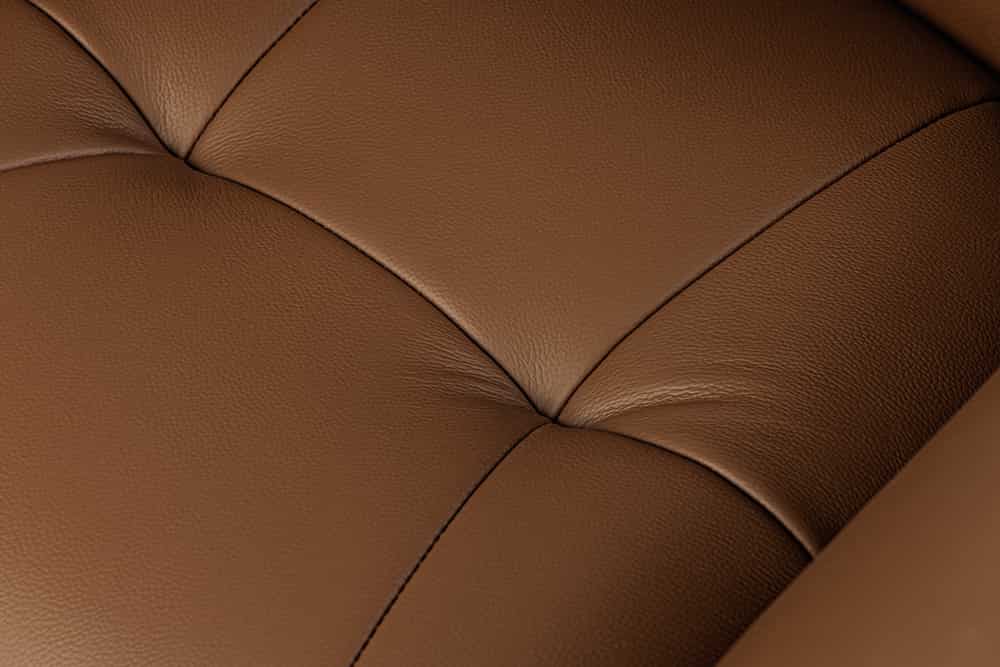 Drehbarer Stuhl SIGNATURE cognac braun Echtleder 360° Taschenfederkern schwarz Metall