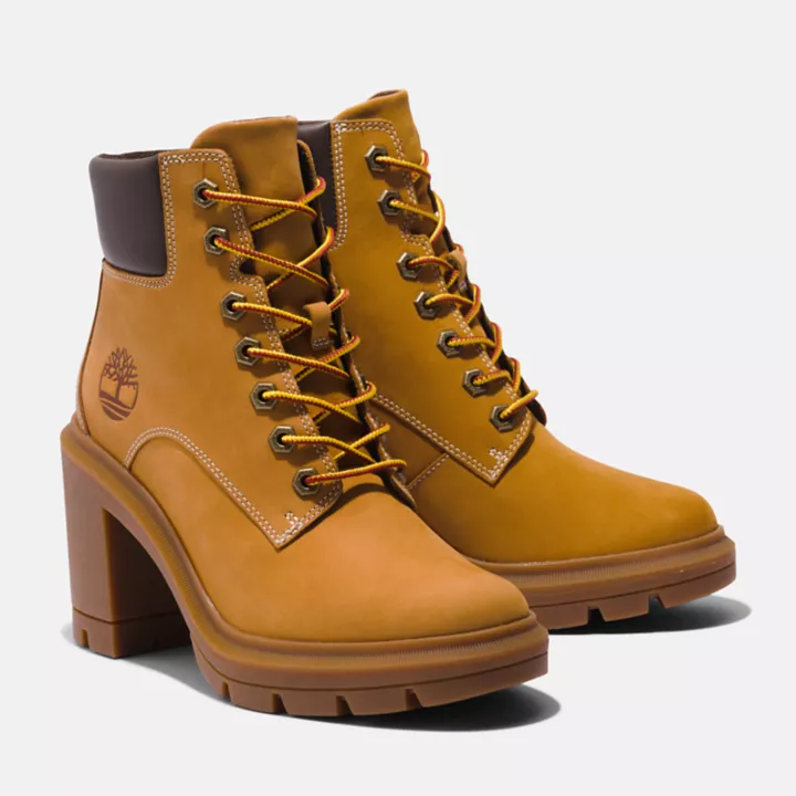 Bota feminina Allington de cano alto com cadarço, na cor amarela.