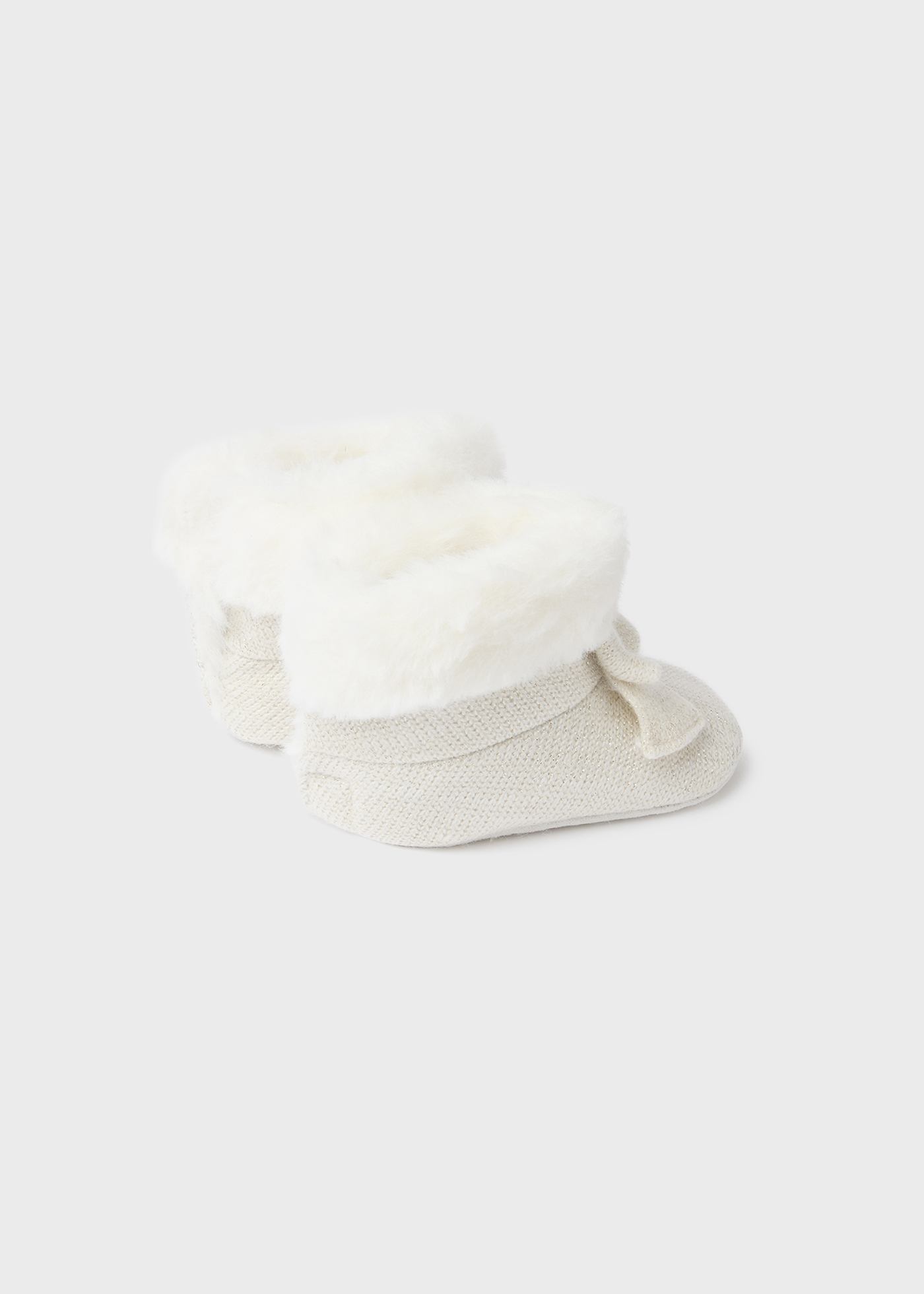 Bota de tricô com pelo de recém-nascido