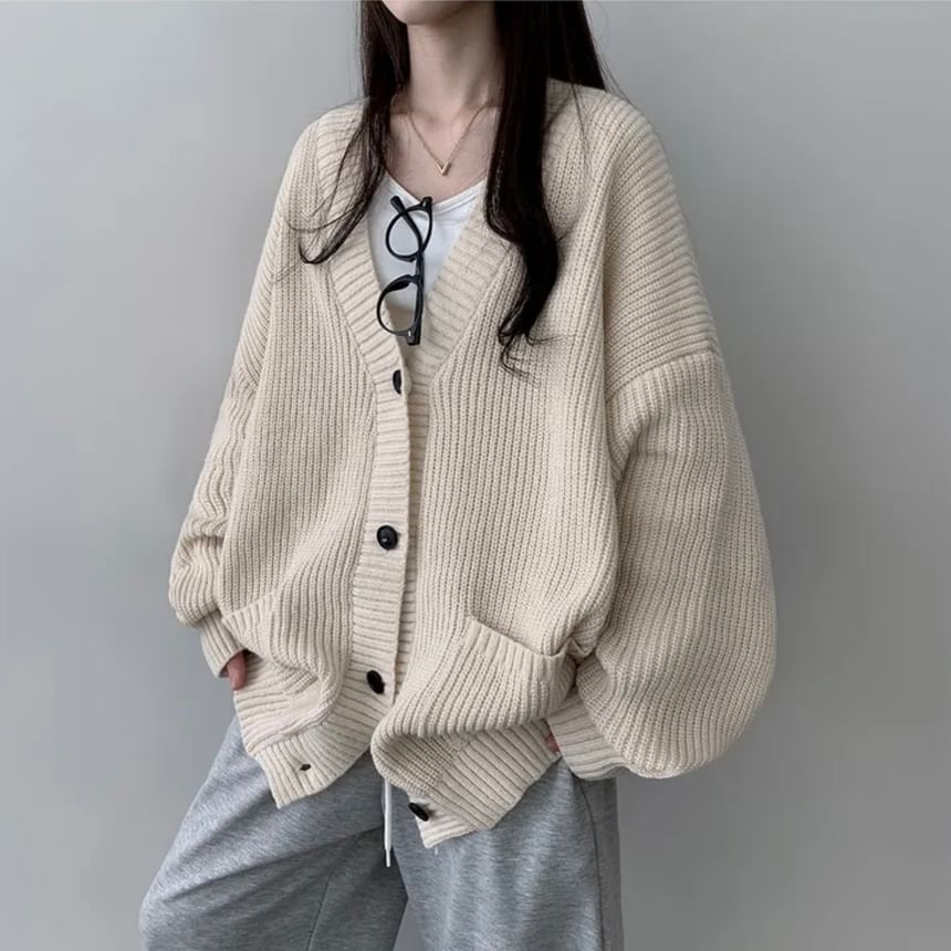 Coris - Oversized vest met pofmouwen, V-hals en effen zakdetail