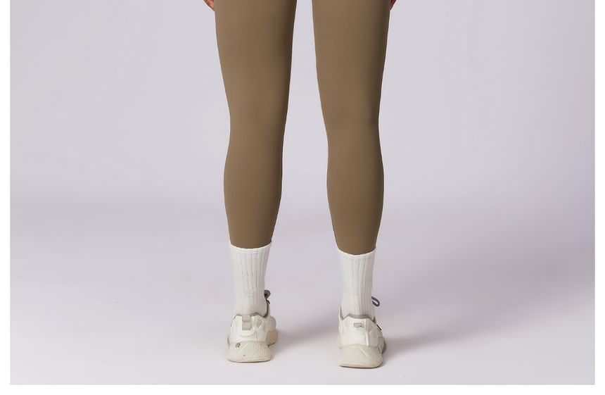Skinniano - Sportjumpsuit met lange mouwen en halve rits
