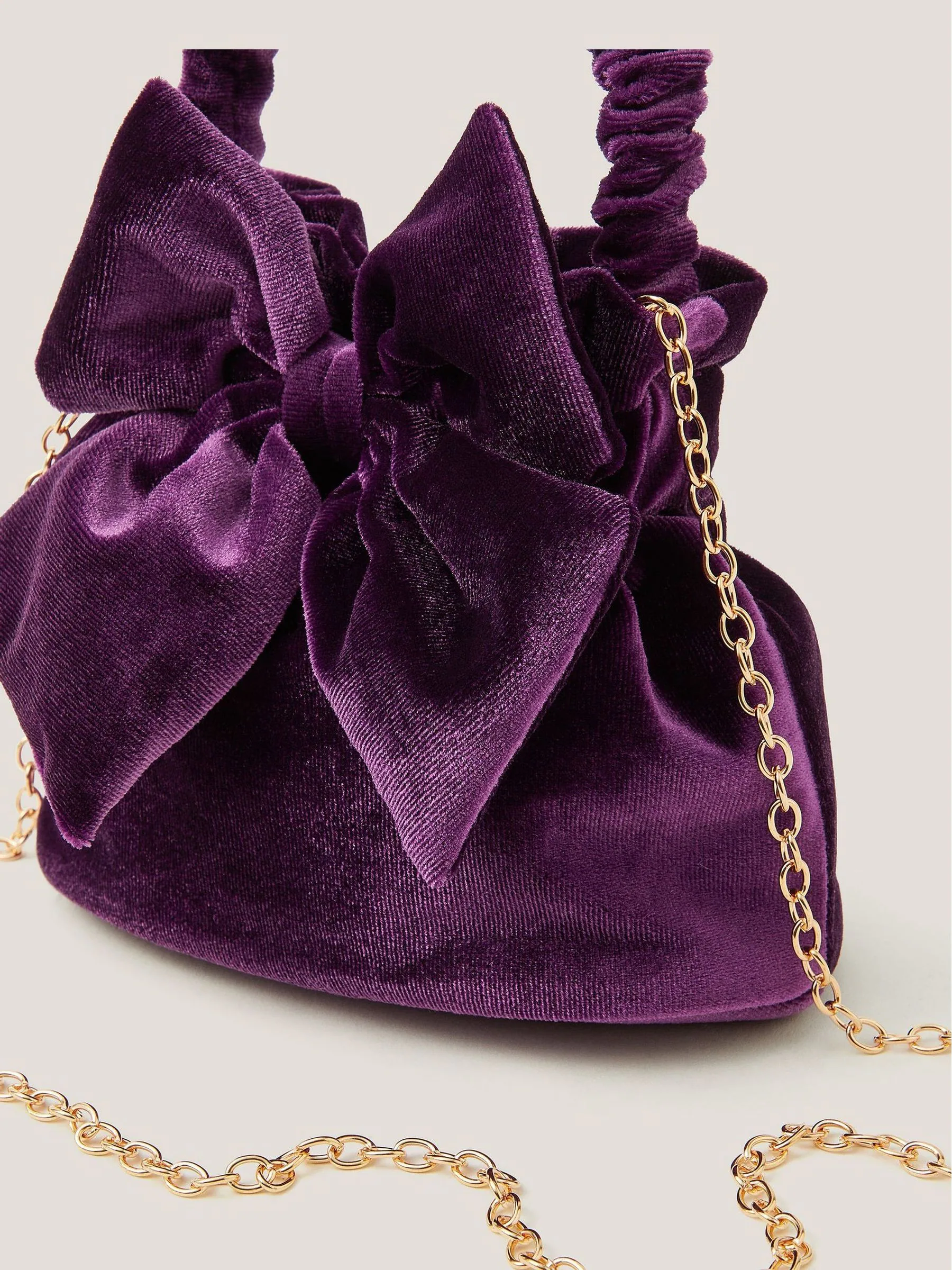 Monsoon Bow Velvet Pouch Bag