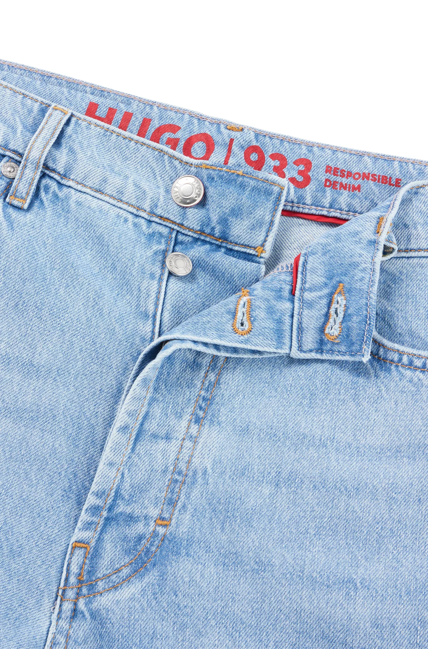 Calça jeans HUGO vermelha, de perna larga e corte moderno, em denim rígido azul.
