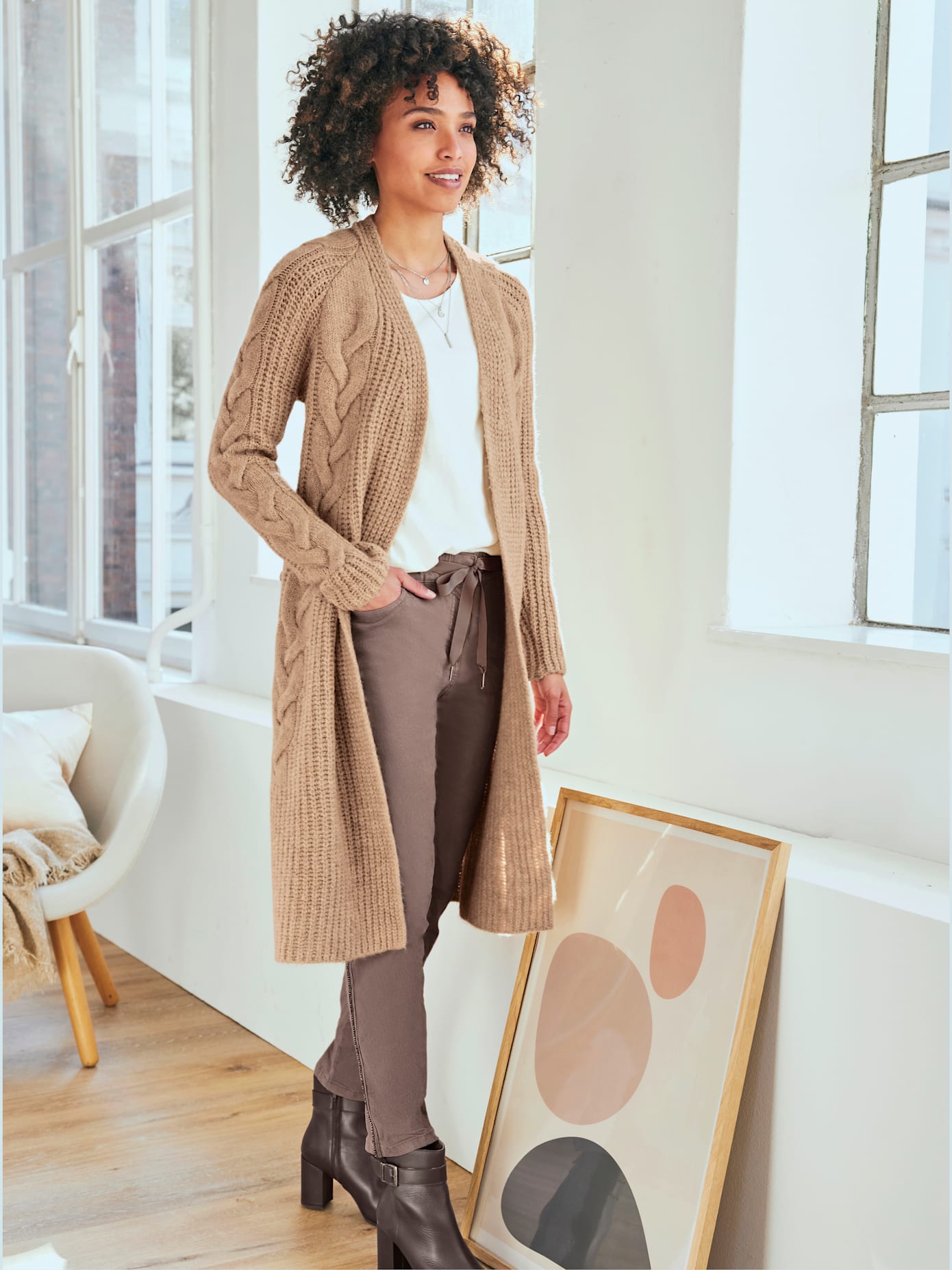 Manteau en tricot motif torsadé devant et aux manches