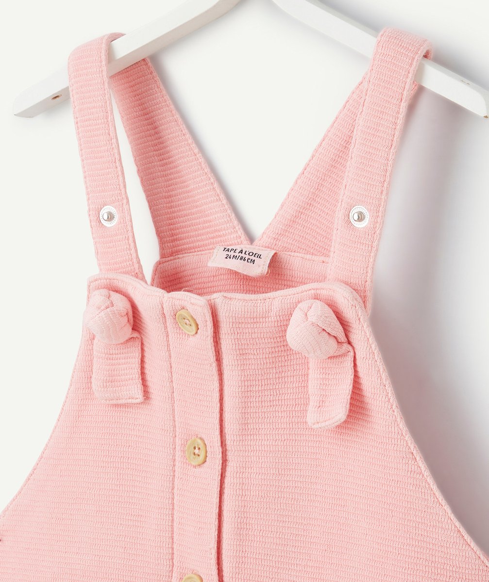 salopette bébé fille rose en nid d'abeilles avec noeuds