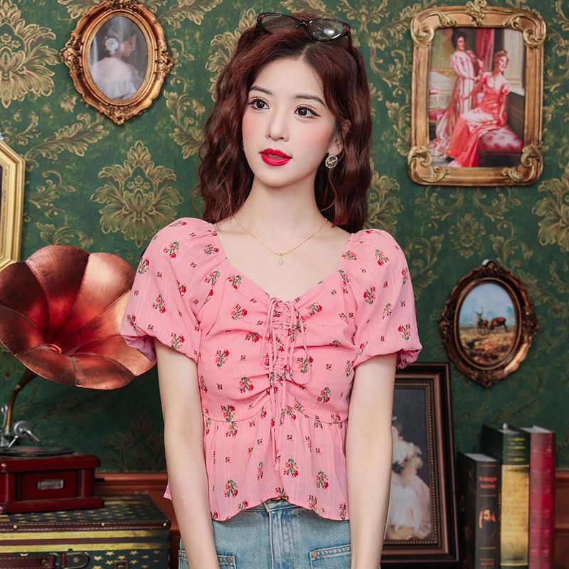 Bornite - Blouse met pofmouwen, V-hals, bloemenprint en trekkoord, peplum