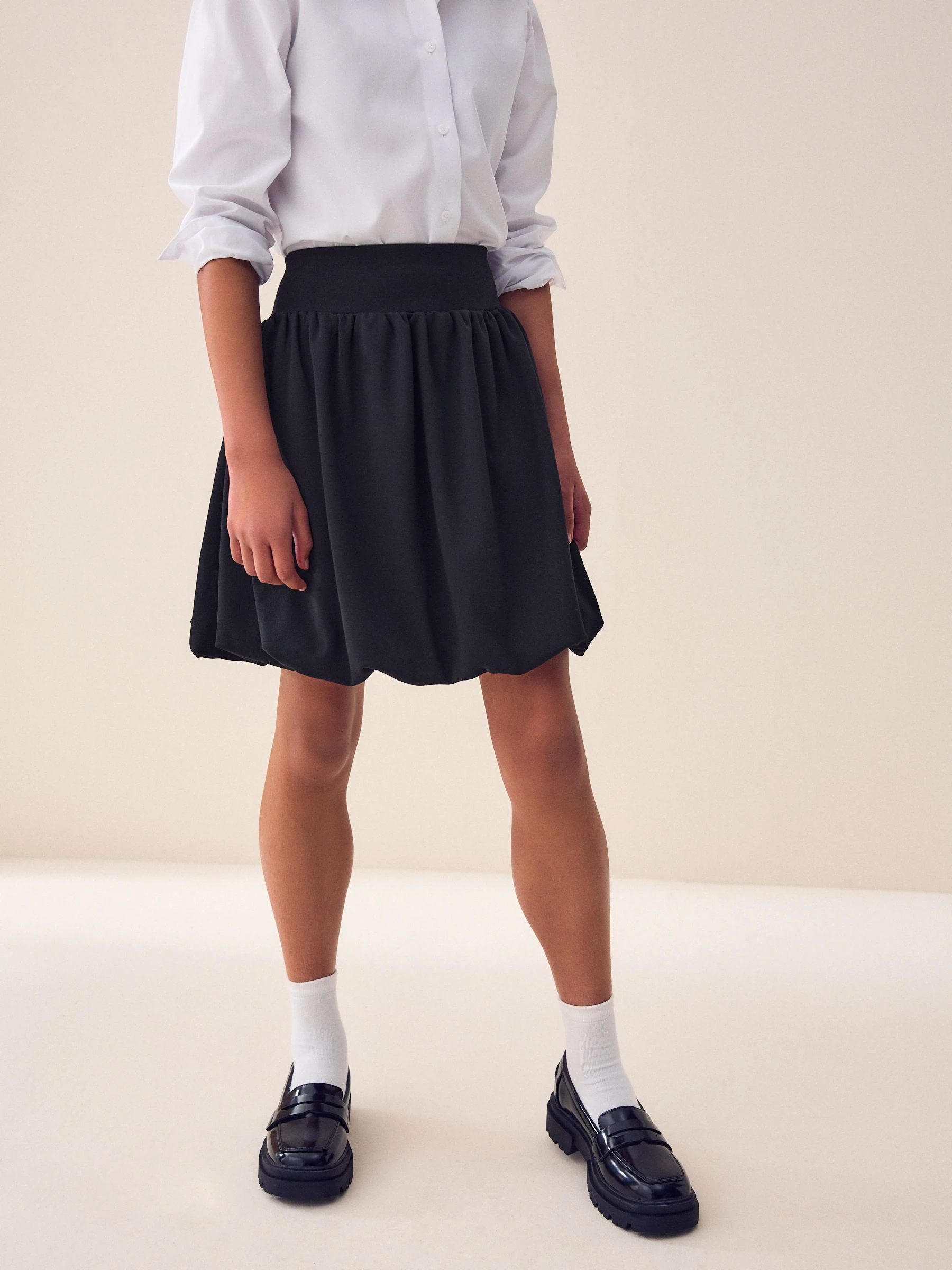 Zwart - Jersey stretch rok met ballonzoom en elastische taille (3-17jr)