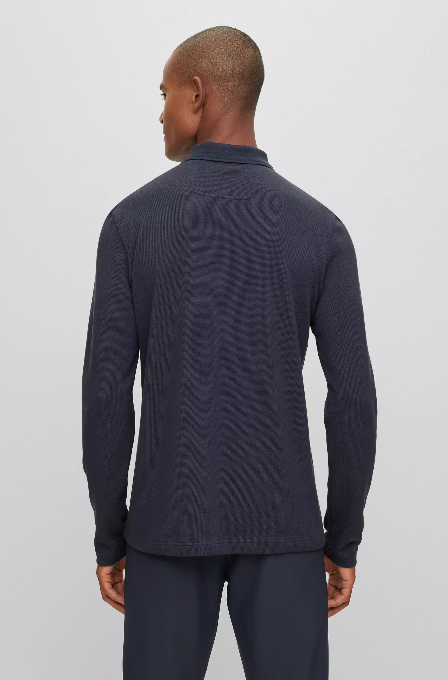 Camisa polo BOSS verde de manga comprida em piqué de algodão com logotipo contrastante.