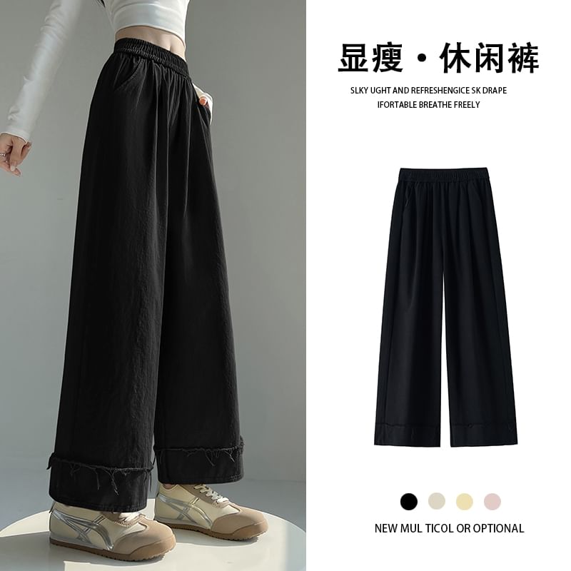 Tel tot 10 - Elastische taille, effen wijde broek