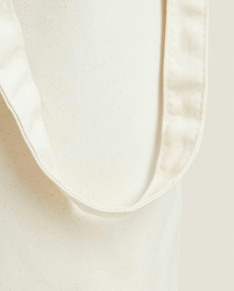 Cesto de roupa redondo com alças