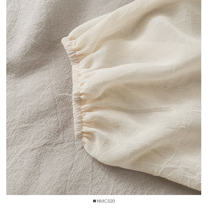 Lemongrass - Chiffon vest met strikceintuur en ballonmouwen