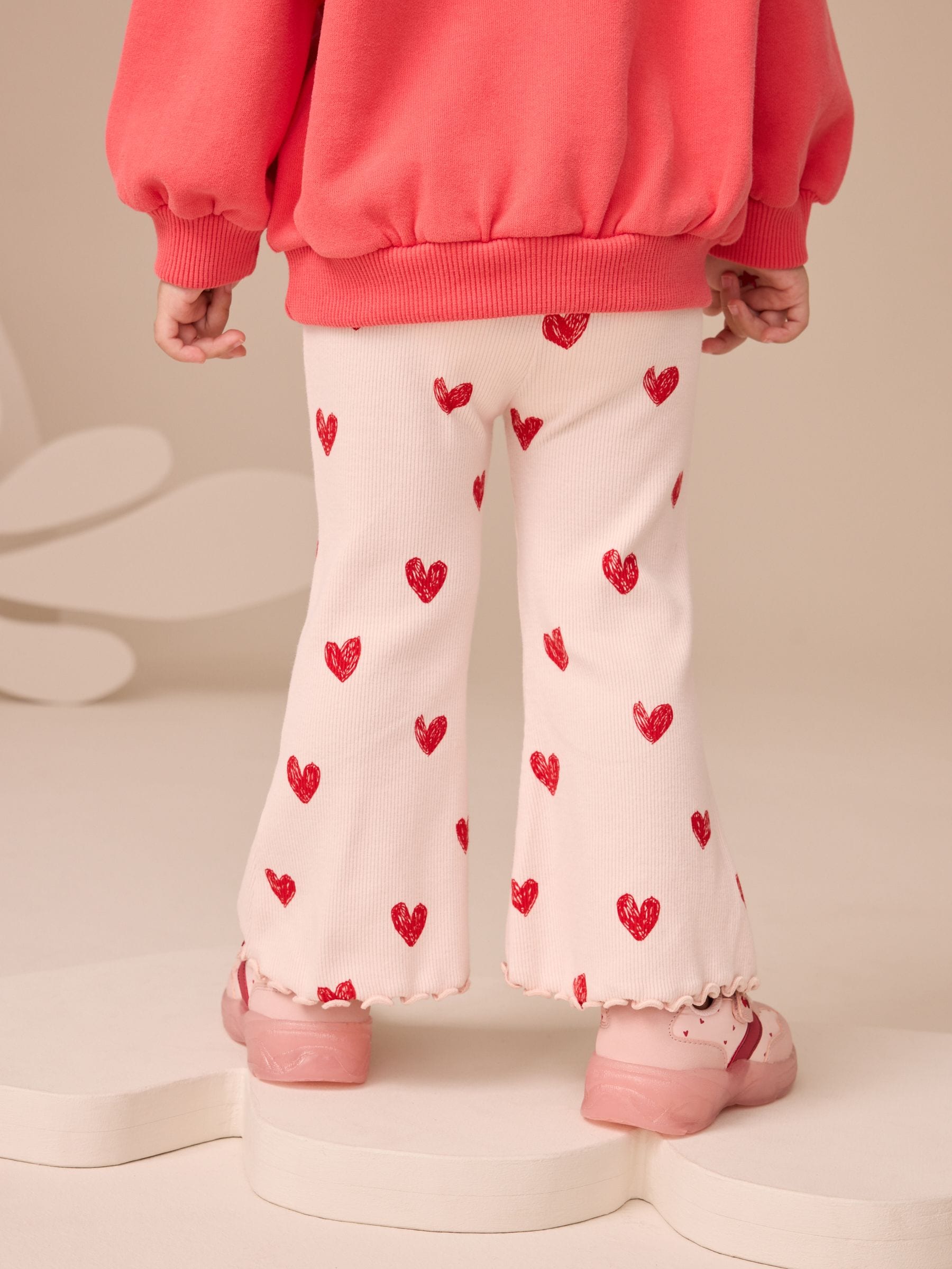 Lichtroze met hartje - Geribbelde flare legging (3 mnd-7 jr)