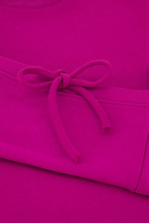 Fuchsia sweater met strikjes