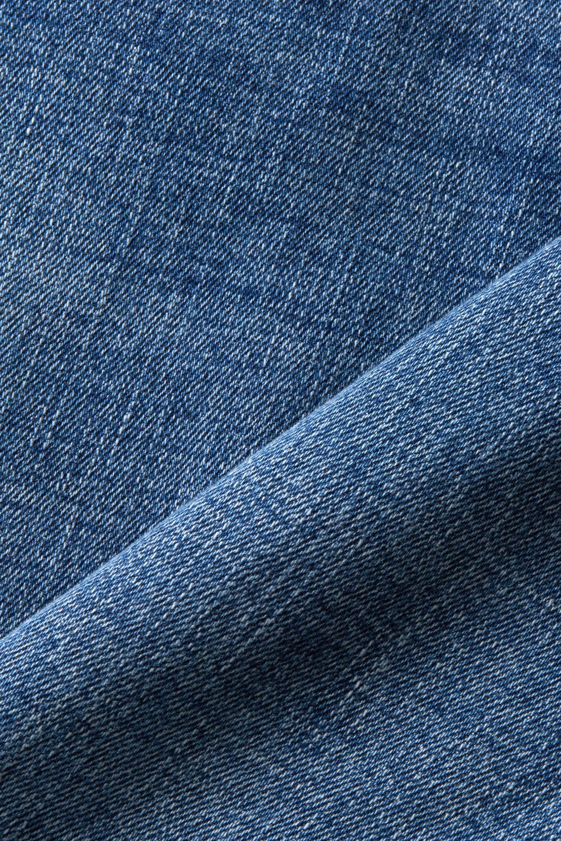 En matière recyclée : jean stretch de coupe Skinny Fit taille mi-haute