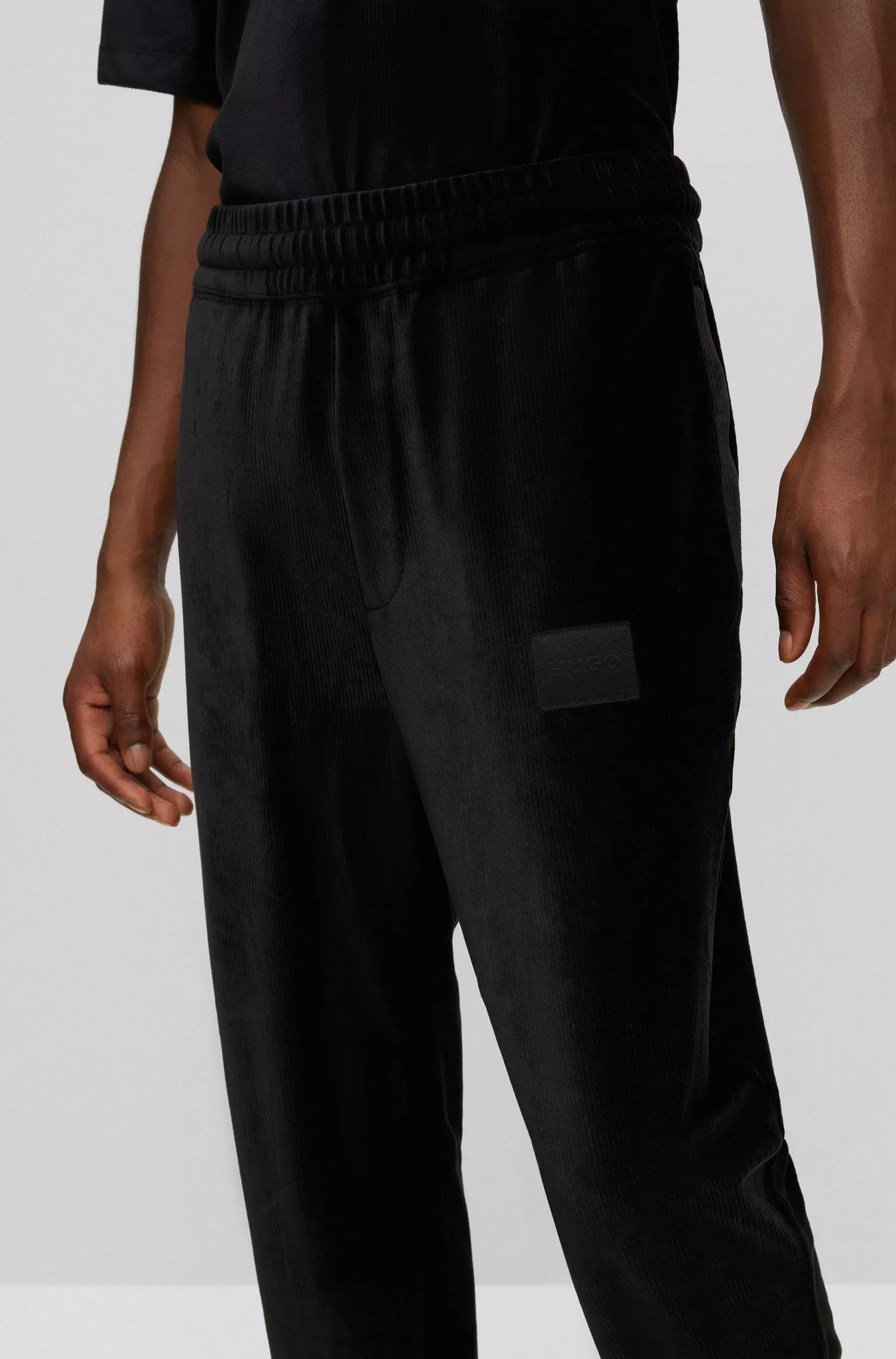 Calça de fato de treino HUGO vermelha, corte descontraído, em veludo cotelê elástico.