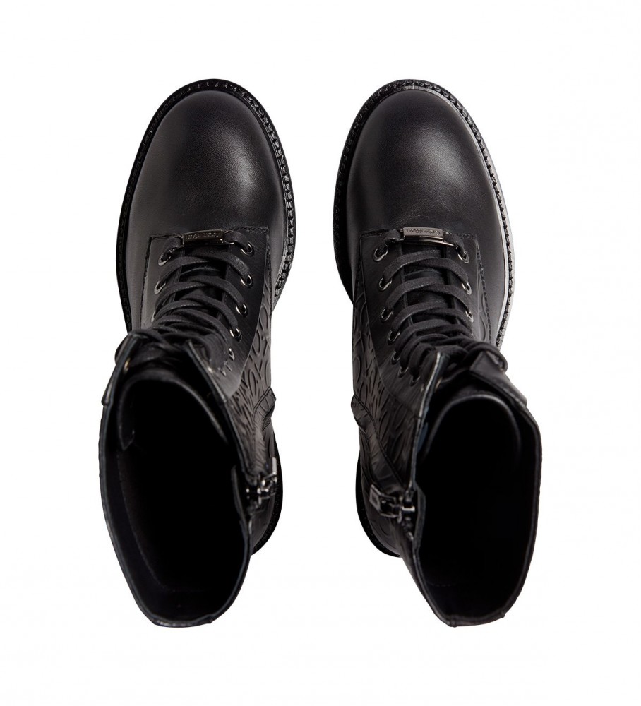 Botas de combate Calvin Klein com sola de borracha, em couro, pretas.