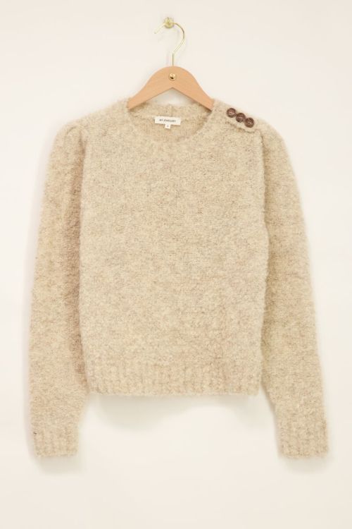 Beige trui met knopen op schouder