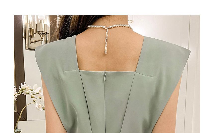 Arabesquito - Mouwloze jumpsuit met wijde pijpen en effen stof
