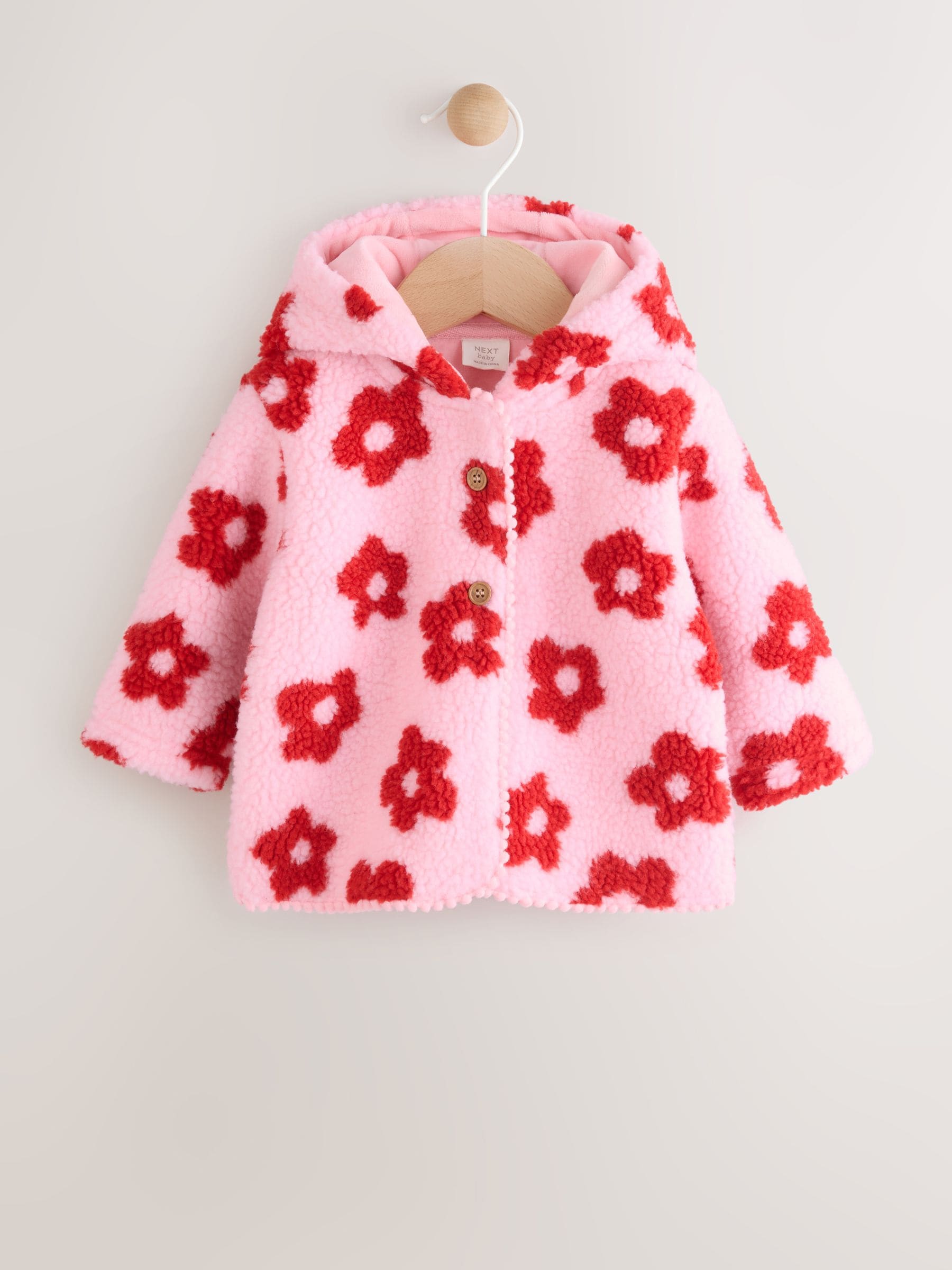Roze bloemenprint over het geheel - Borg babyjack met capuchon (0mnd-2jr)