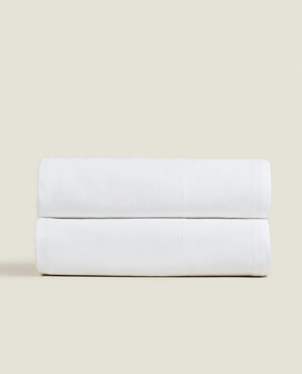 Colcha de algodão com borda
