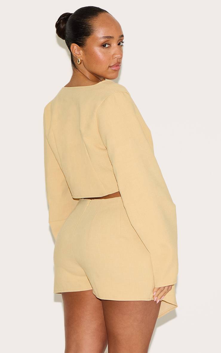 Citron Blazer Shape Asymétrique En Tissu Tissé Avec Boutons Martelés