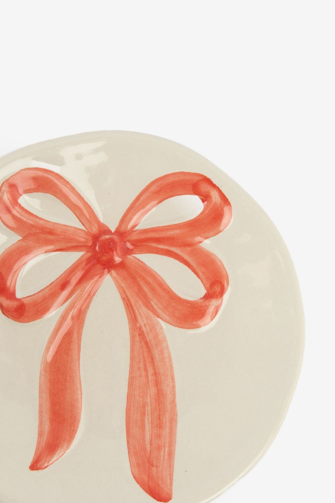 Beige dessertbord met roze strik