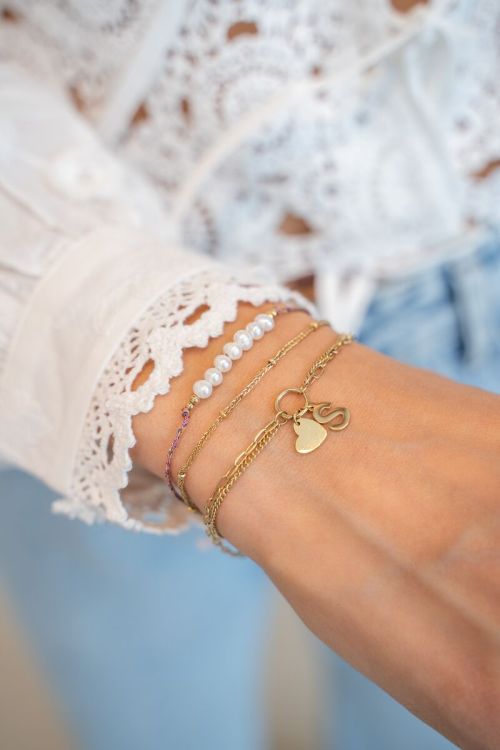 Minimalistische dubbele armband met roze koord en parels