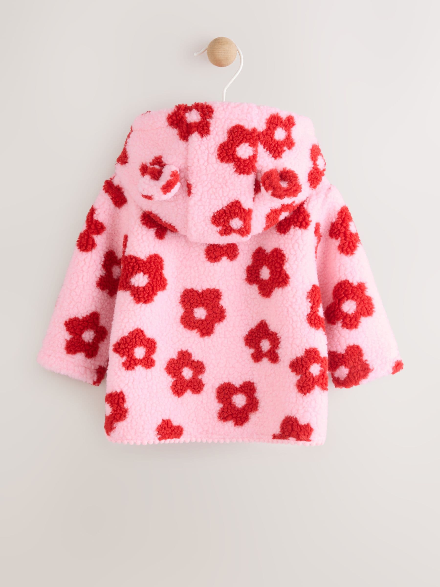 Roze bloemenprint over het geheel - Borg babyjack met capuchon (0mnd-2jr)