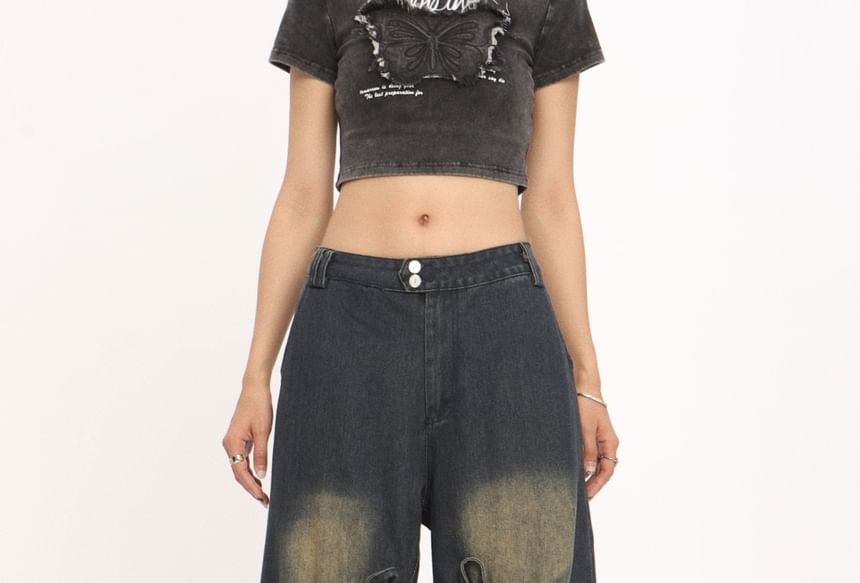 Berrytrix - Lage taille jeans met strikaccent en uitsparingen, gewassen en wijde pijpen