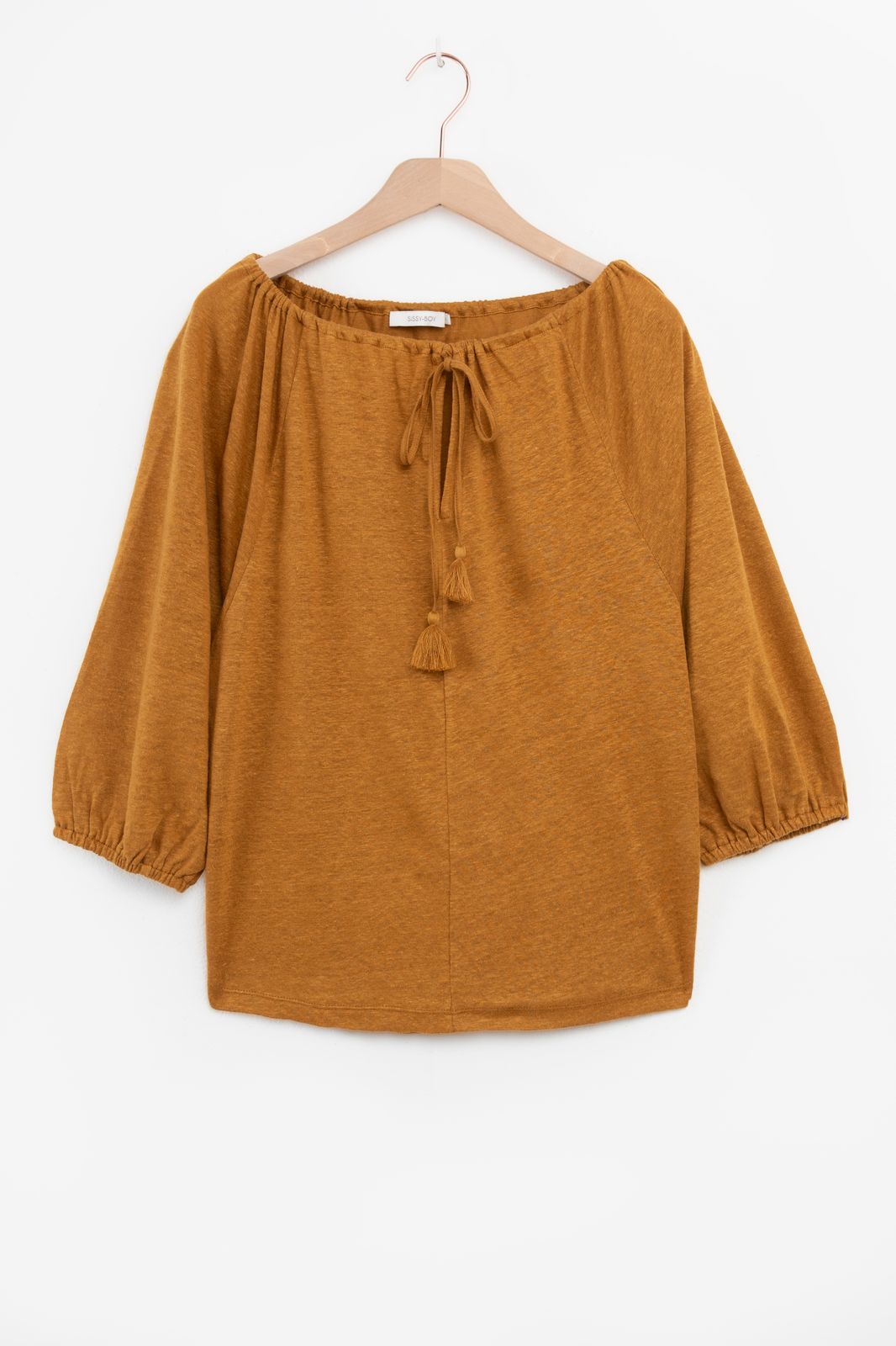 Goudbruine top met kwastjes
