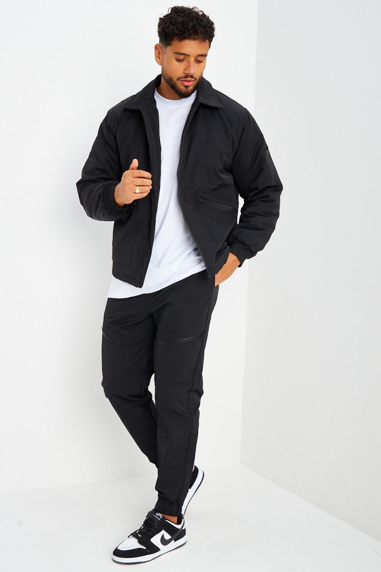 Blouson noir à poches zippées