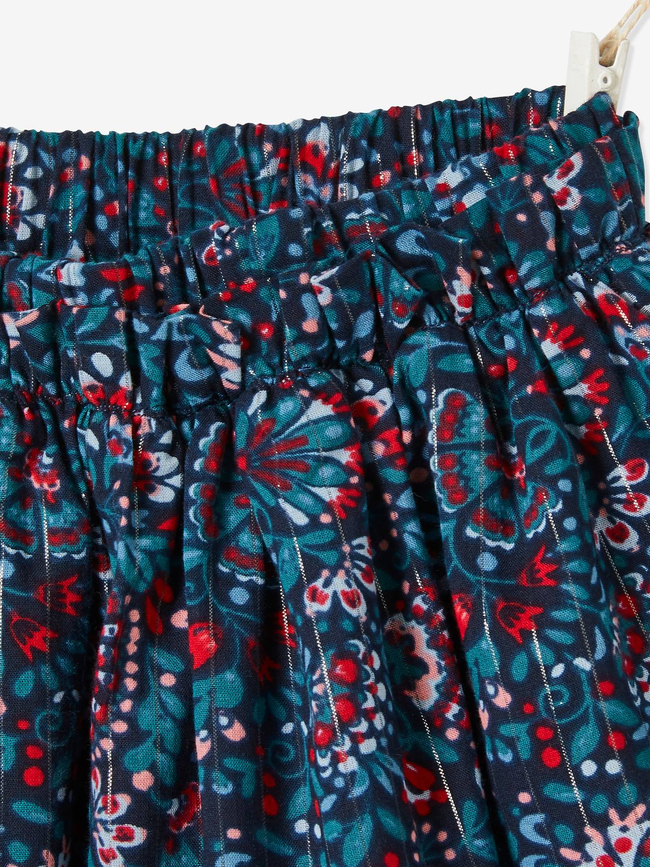 Saia estampada floral com detalhes em fios brilhantes, estampa azul vibrante para menina.