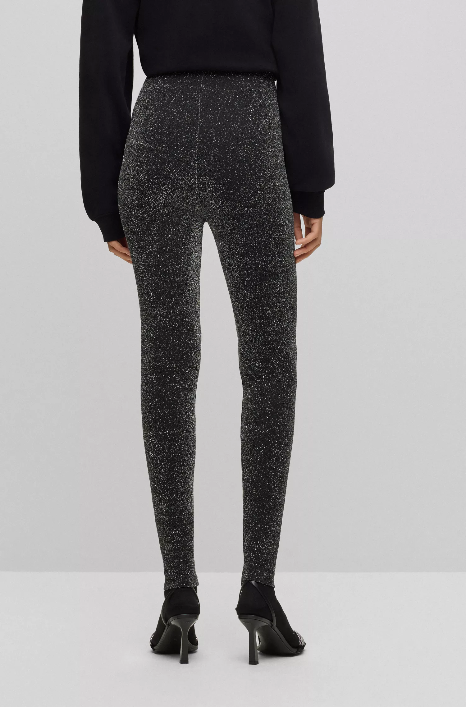 Leggings HUGO com efeito glitter vermelho e cós com logo.