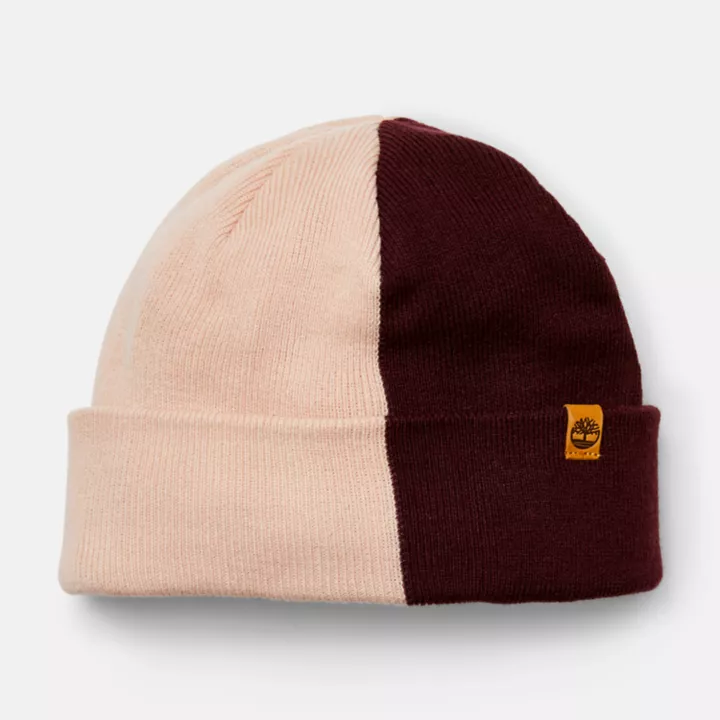 Conjunto de presente feminino com gorro e cachecol em blocos de cores rosa.