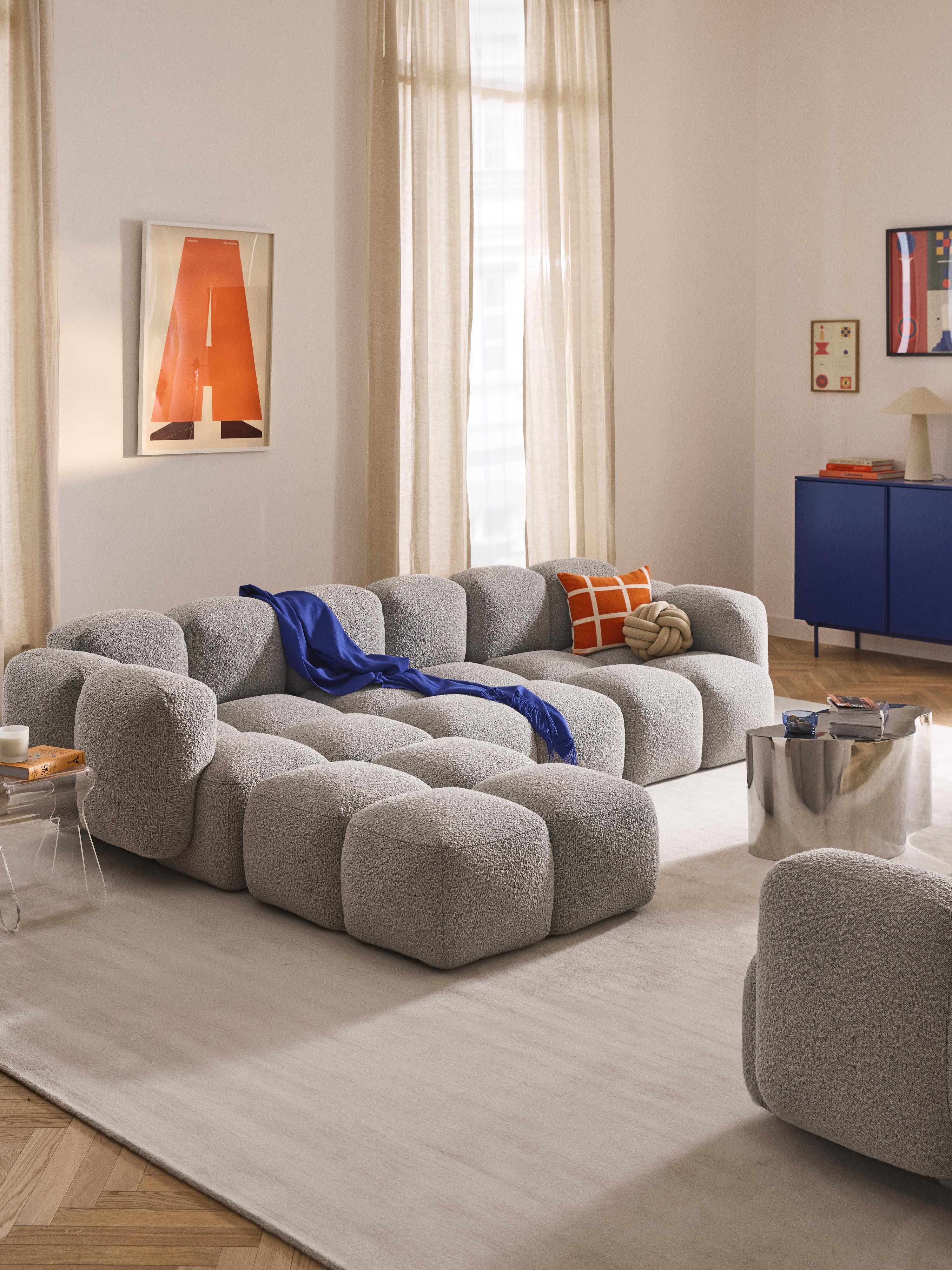 Modulaire bank Tayla (4-zits) van bouclé met poef (links/rechts)