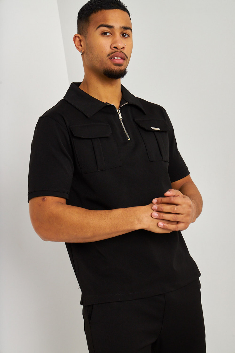Polo uni noir col zippé à poches