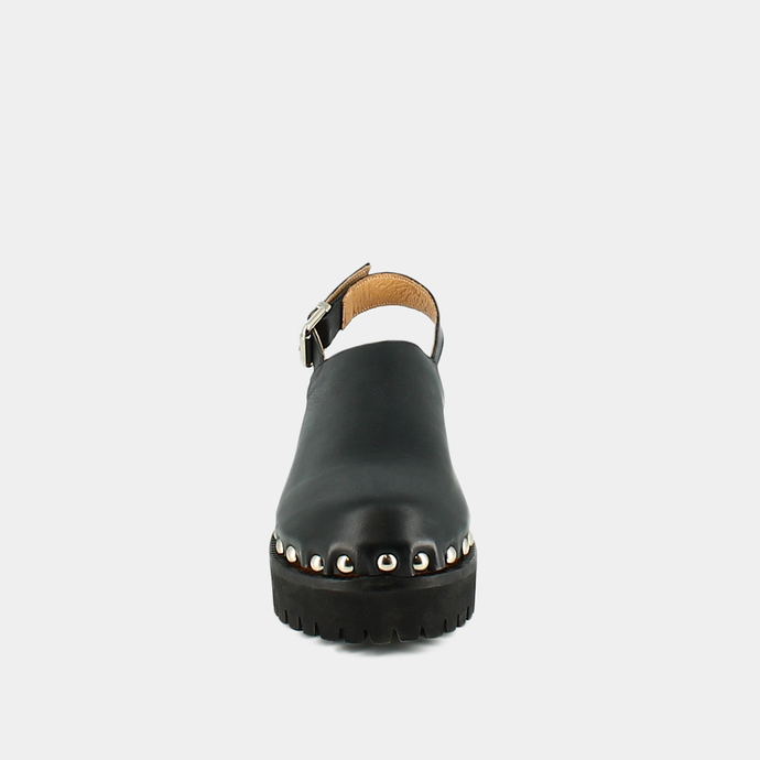 Mules à semelles crantées et clous  en cuir noir