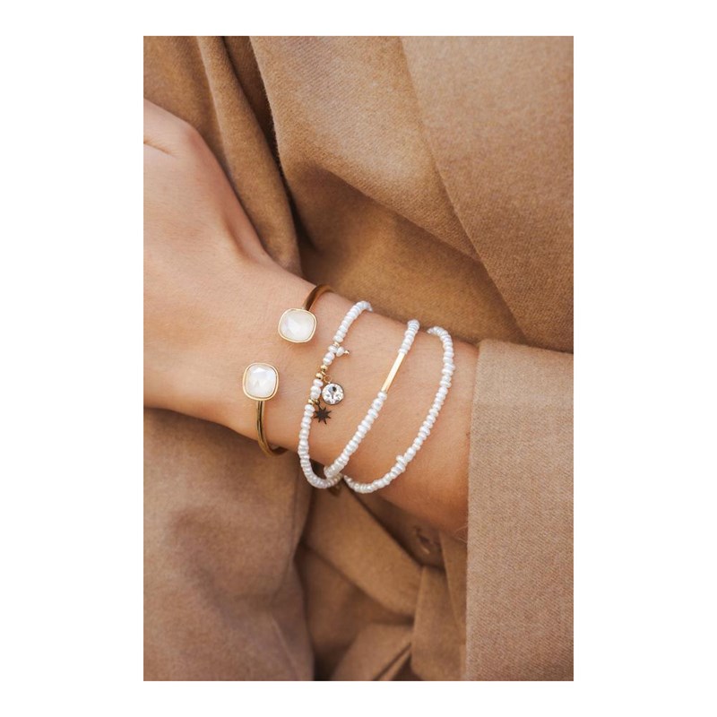 Bracelet rigide en acier doré orné de deux cristaux taillés couleur prune