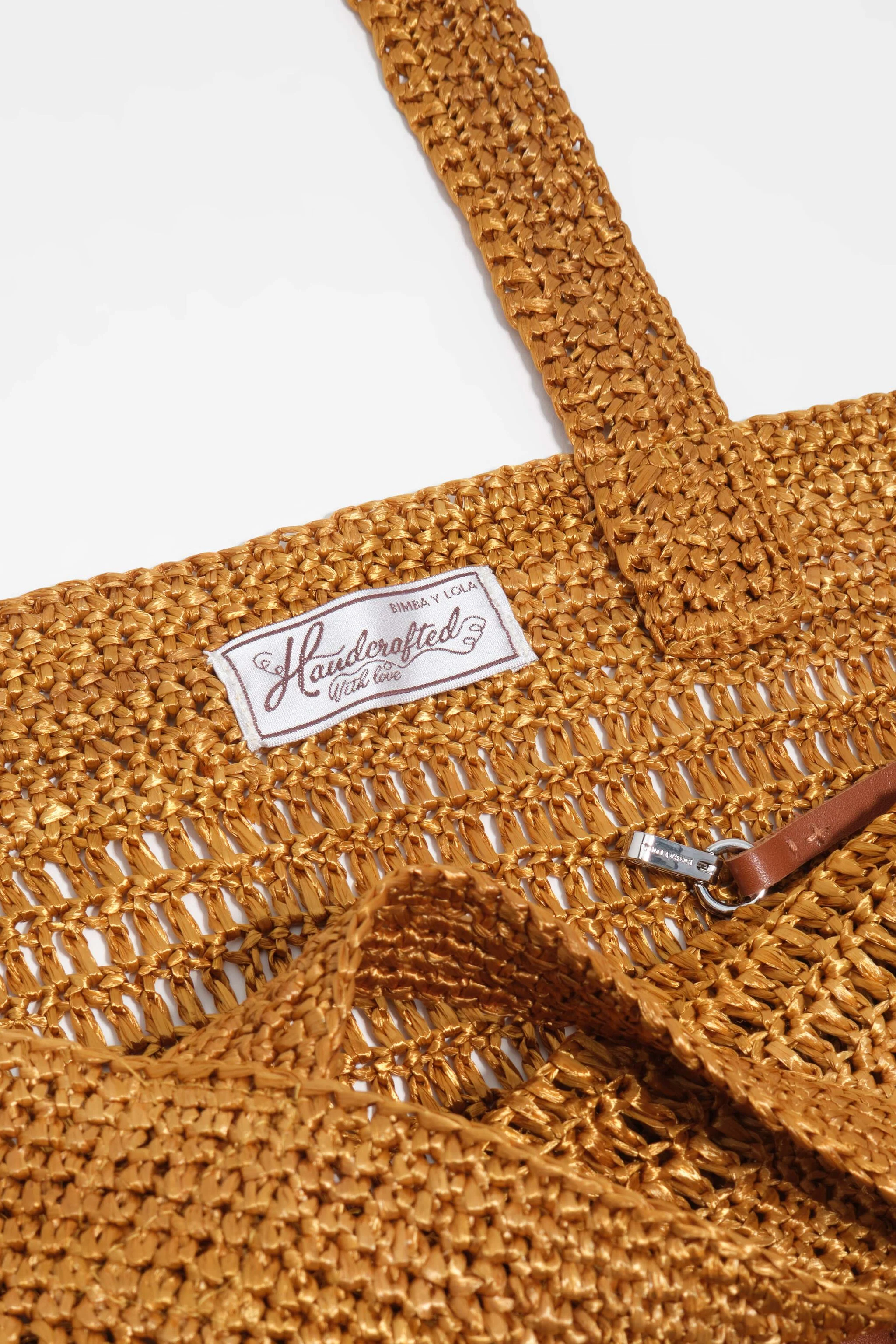 Bolsa grande trançada dourada
