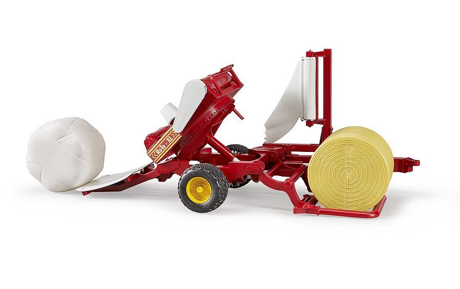 Landwirtschaftsfahrzeug BallenwicklerBallenwickler mit ockerbraunem und weissem Rundballen