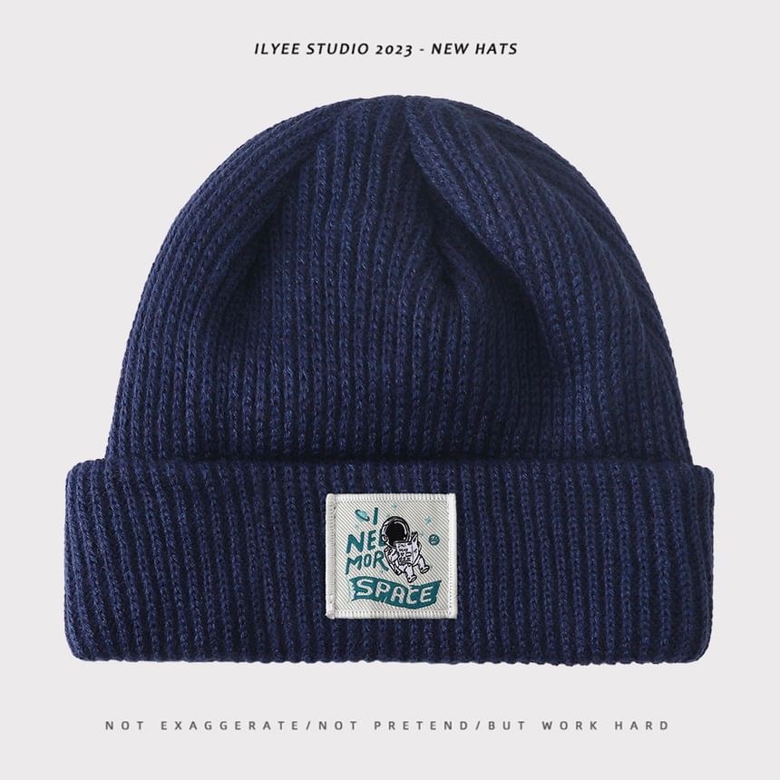 Uweiifame - Effen muts met appliqué