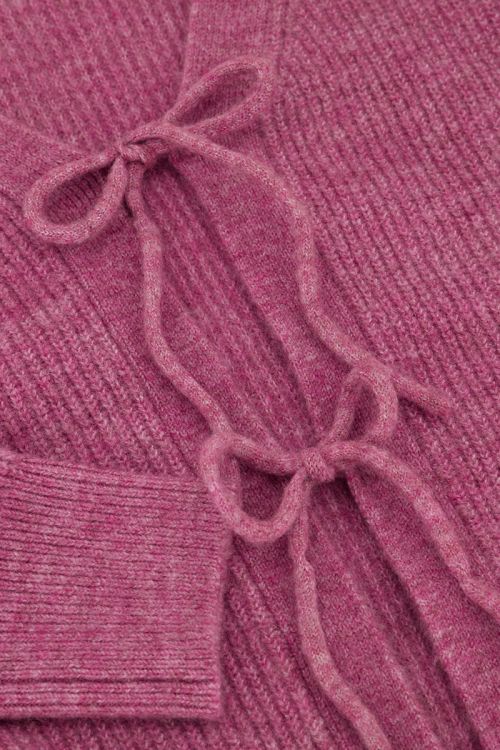 Roze vest met strikjes