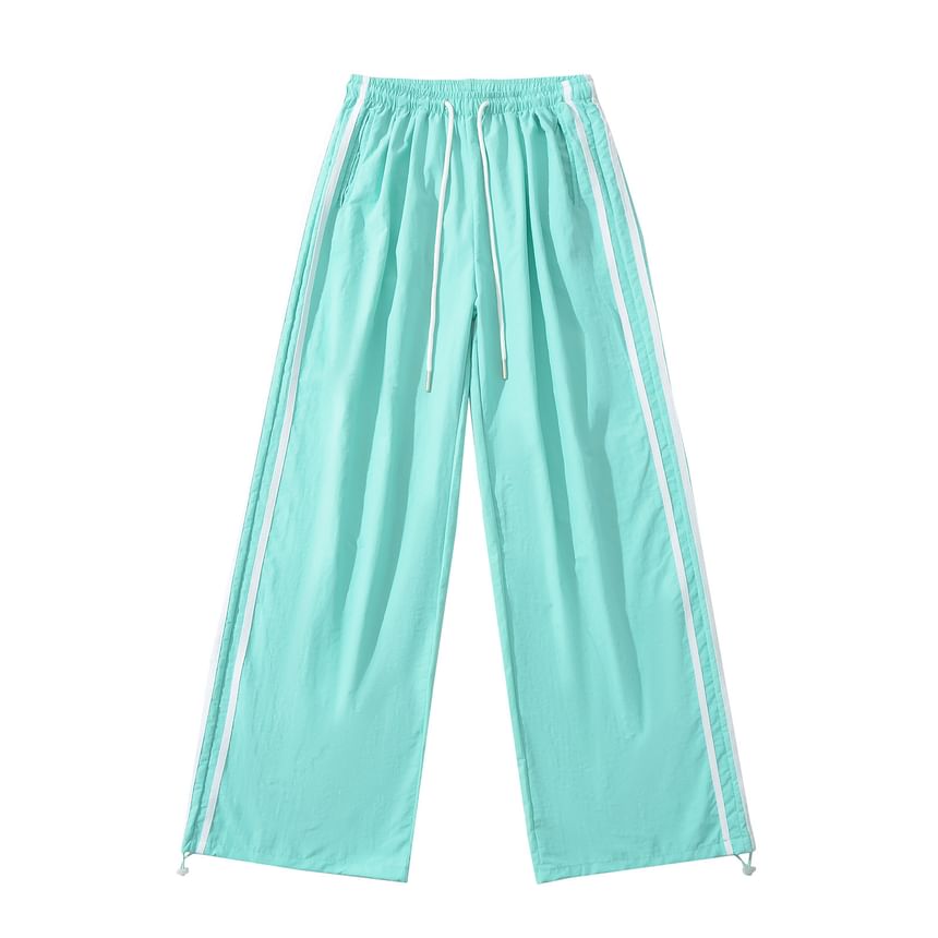 Asiris - Gestreepte, losvallende joggingbroek met hoge taille en wijde pijpen