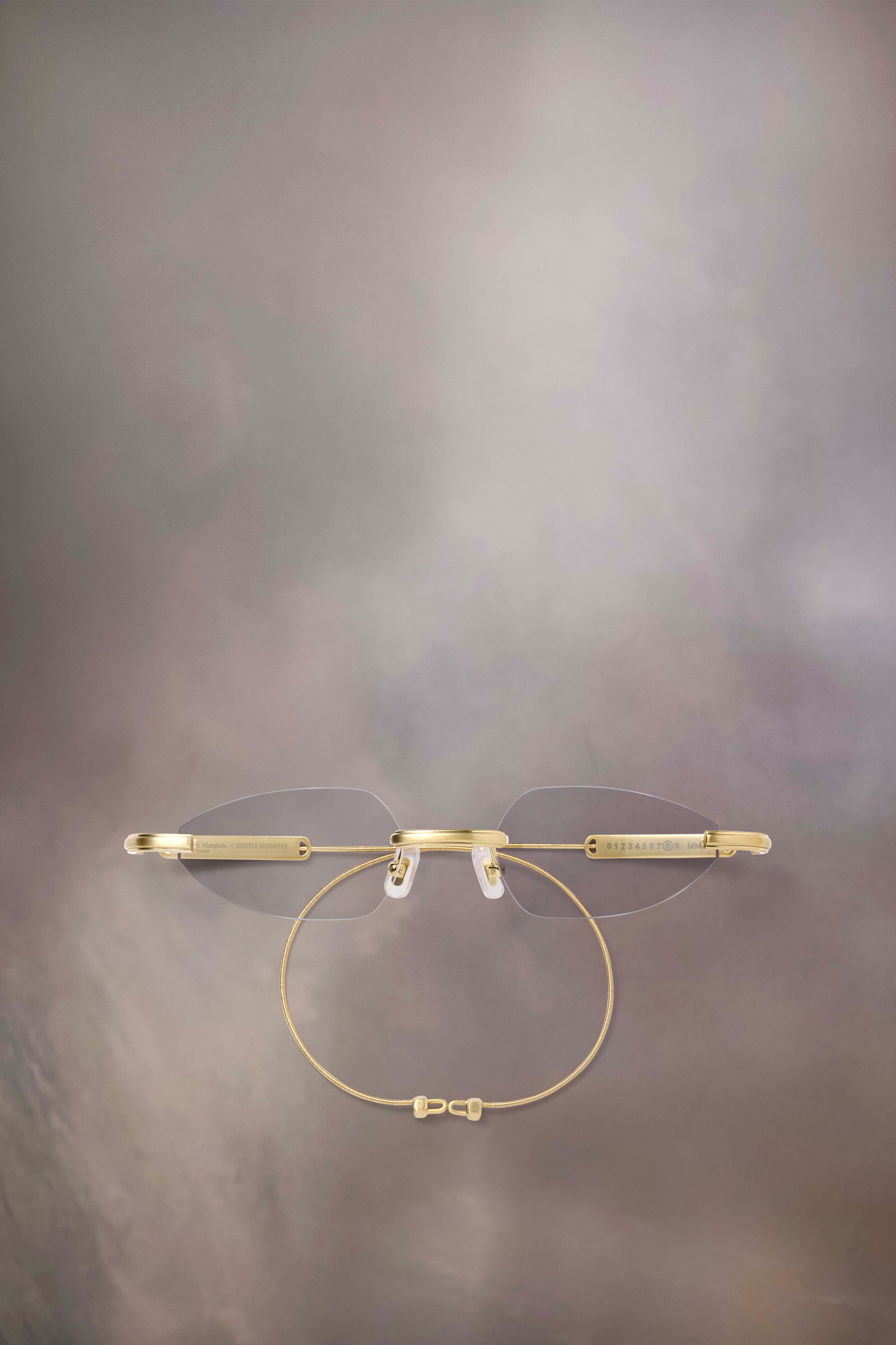 Lunettes sans monture dorées x Gentle Monster​