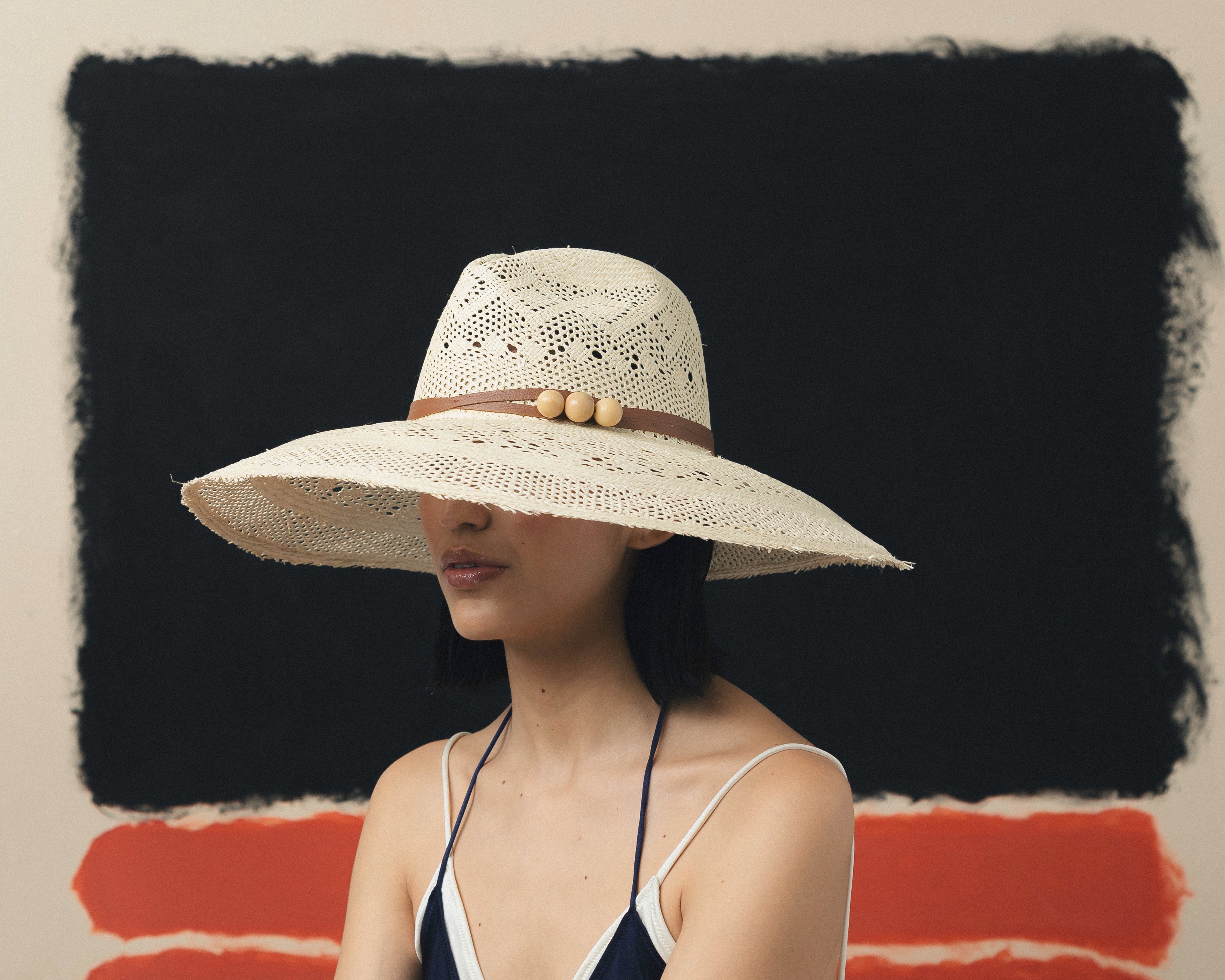 Chapeau Aguacate à long bord en cuir tressé ajouré et effiloché