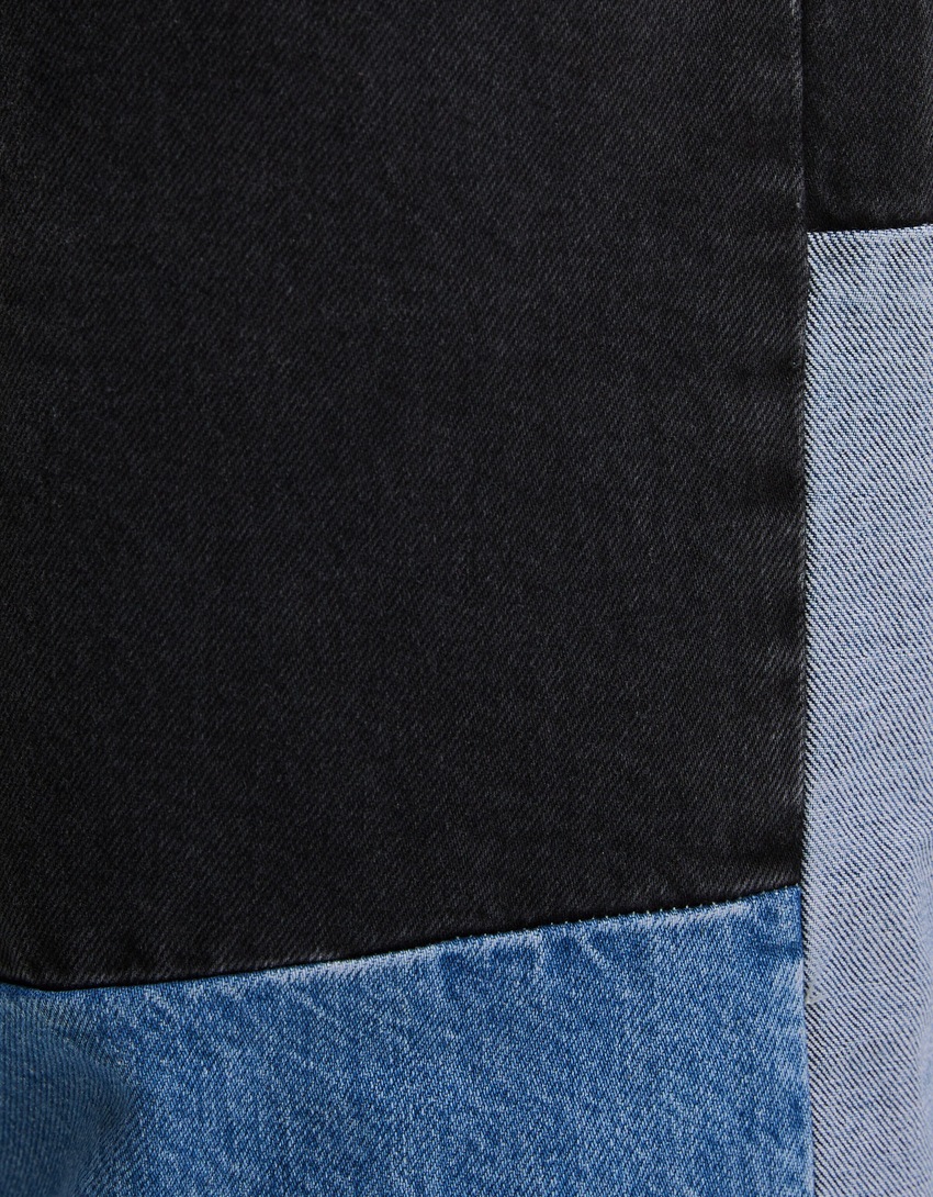 calças jeans super largas com blocos de cores