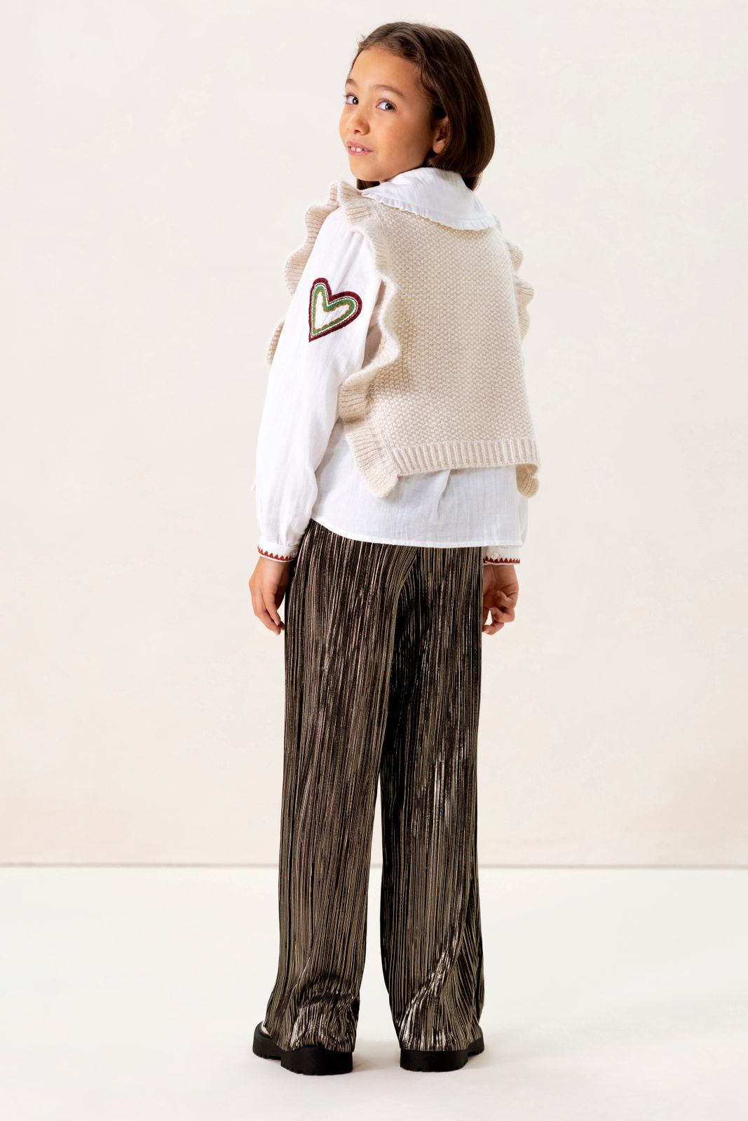 Witte gebreide spencer met ruffles