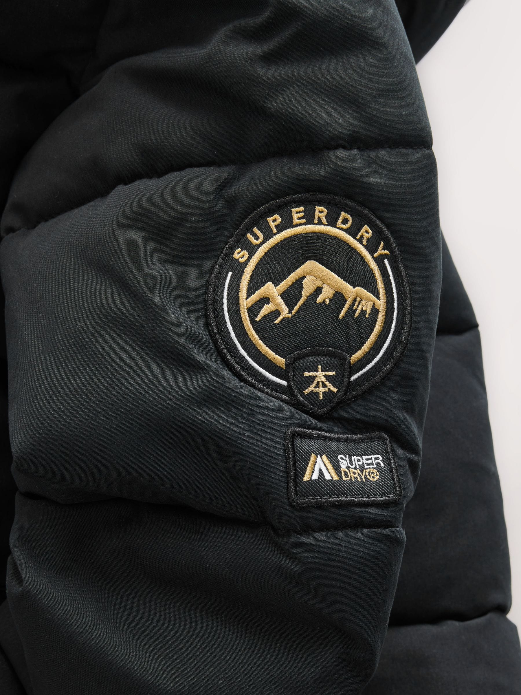 Zwart - Superdry - Lange gewatteerde jas