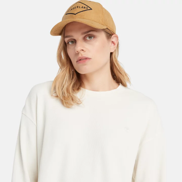 Camiseta feminina de manga comprida com textura waffle na cor branca.